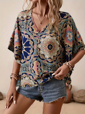 Olivia - Blus med blommigt mönster och V-ringning