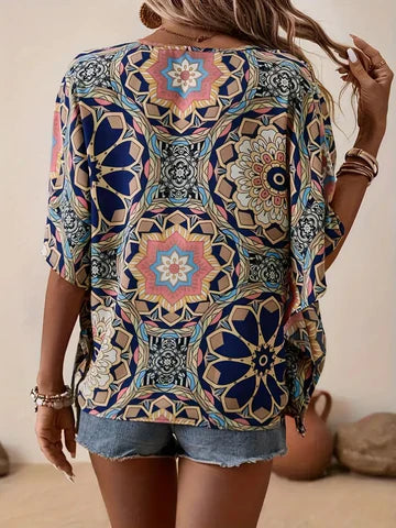 Olivia - Blus med blommigt mönster och V-ringning