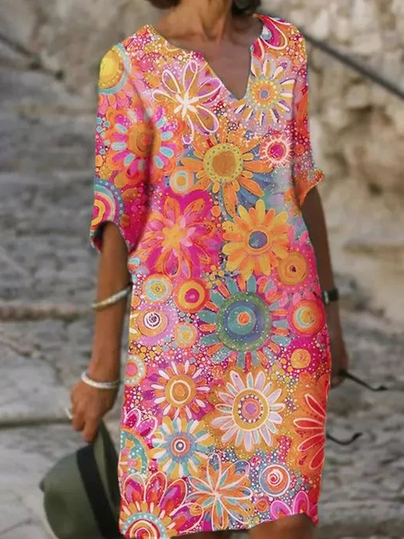 Quinn - Sommarklänning med blommigt mönster och V-ringning