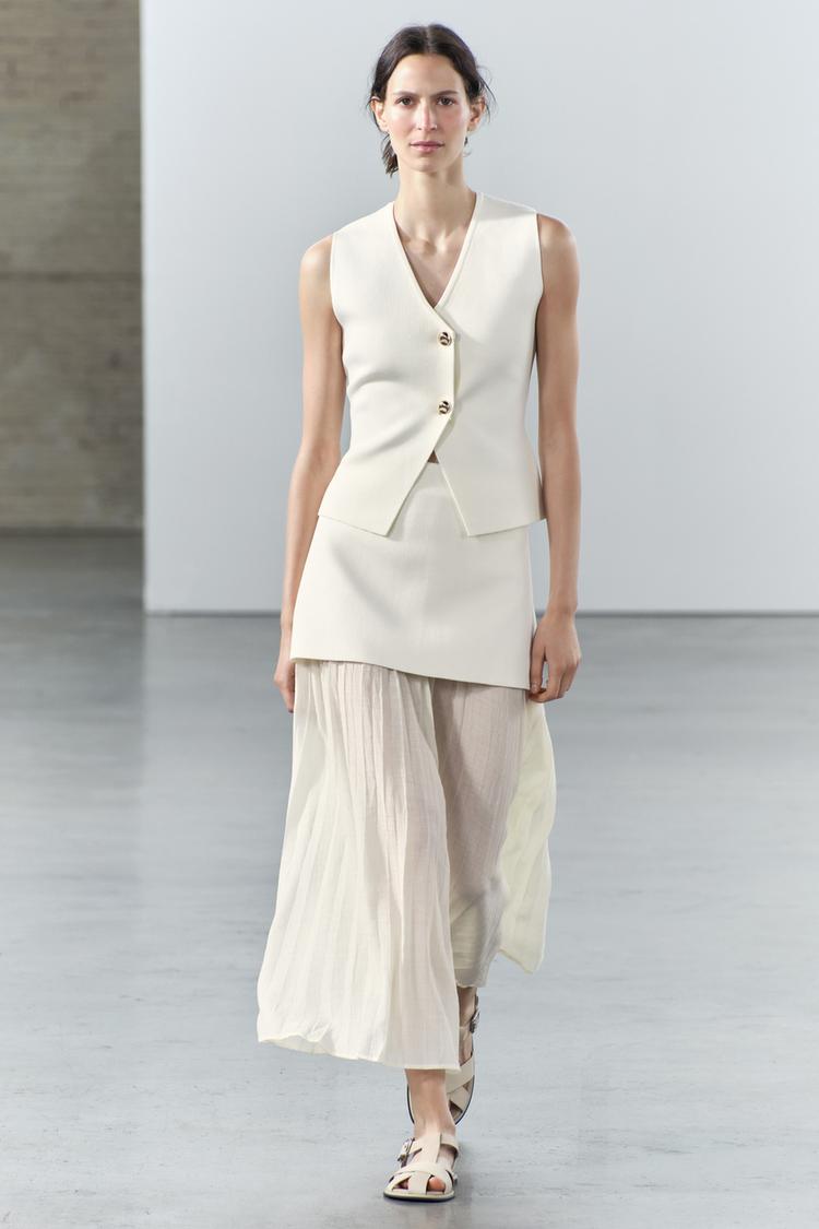 Joy-Kjolset i stickat plisserat lapptäck