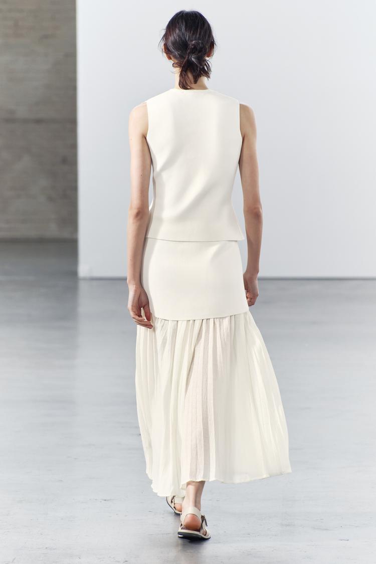 Joy-Kjolset i stickat plisserat lapptäck