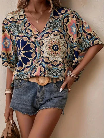 Olivia - Blus med blommigt mönster och V-ringning